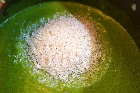 a pic of rice on green broth