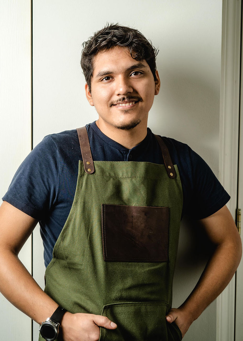 Peruvian Chef Brandon Castillo owner of Chewinghappiness in an apron