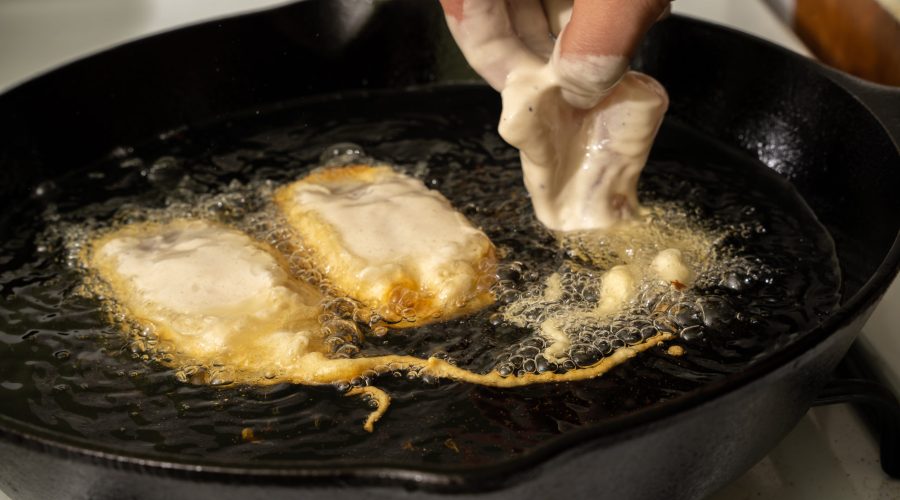 mariscos fritos en aceite caliente - peruvian jalea mixta seafood frying in hot oil