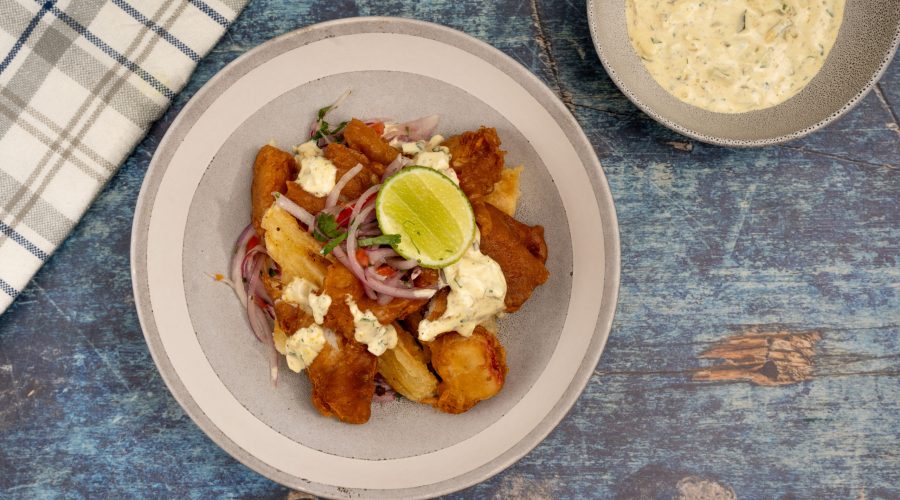 jalea mixta peruana con sarza criolla y yuca frita - peruvian jalea mixta fried seafood with sarza criolla and yucca