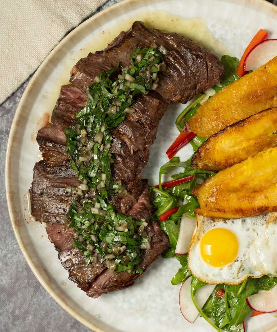 Peruvian bistec a lo pobre with fried egg, plantains, and salad