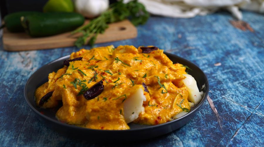 the full Ají de Gallina dish in a bowl (yellow creamy sauce, looks like the main finished dish photo)