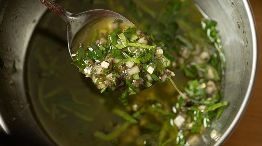"chimichurri de huacatay peruano en bowl - peruvian huacatay chimichurri in bowl