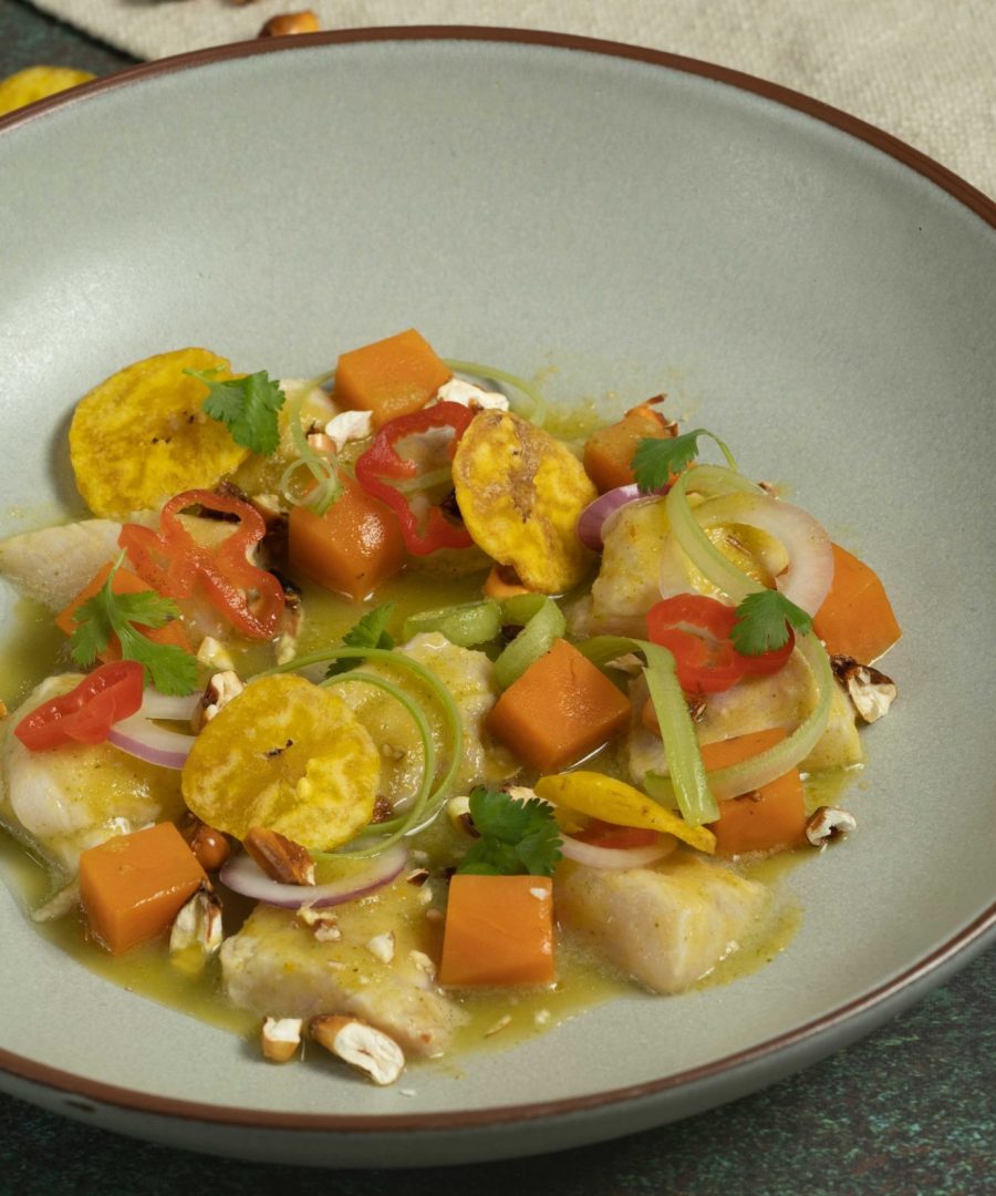 Peruvian ceviche with citrus aji marinade canchita and sweet potato in white bowl - ceviche peruano con marinada citrica canchita y camote en tazón blanco