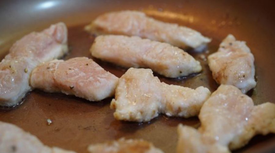 a pic of chicken being cooked on a pan