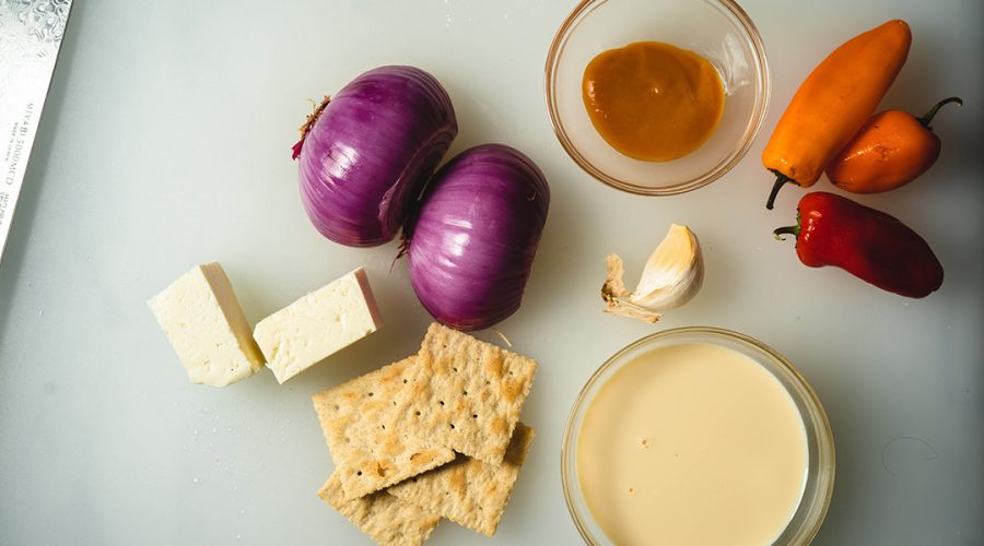a wide variety of dairy and other ingredients on a board