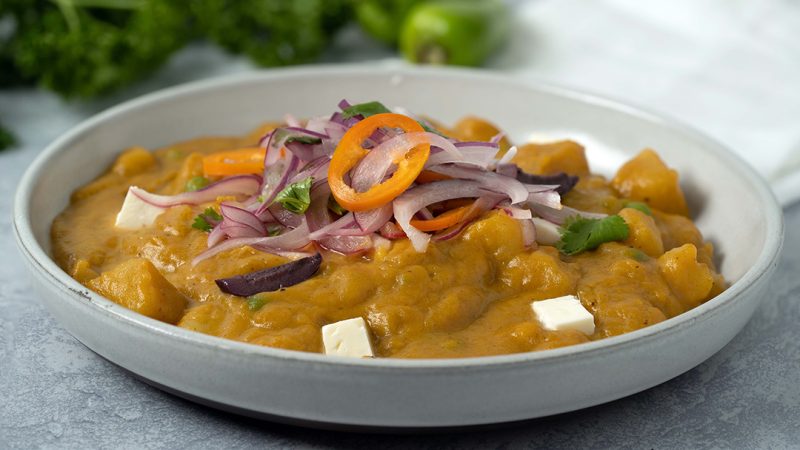 Locro de Zapallo peruano - Peruvian spicy pumpkin stew served with sarsa criolla and queso fresco