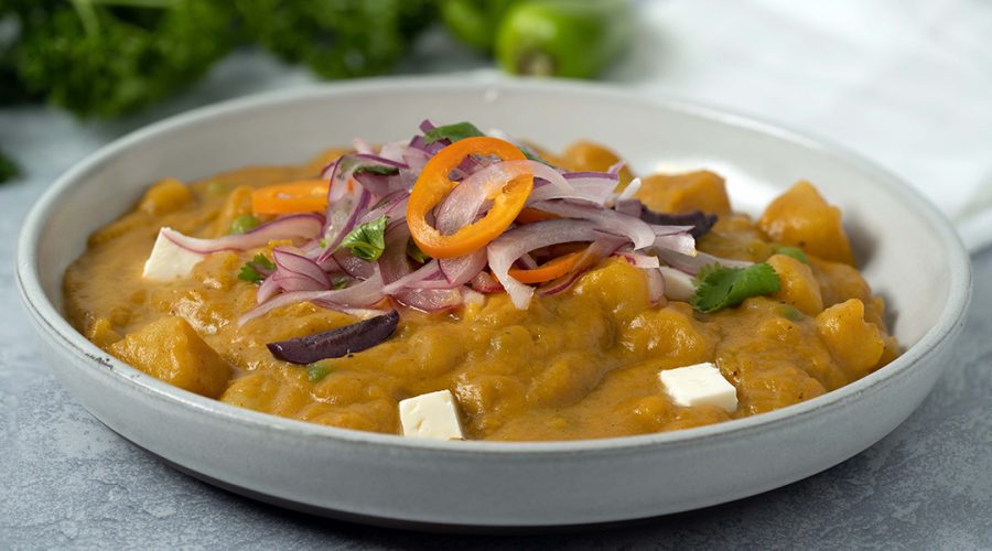 Locro de Zapallo peruano - Peruvian spicy pumpkin stew served with sarsa criolla and queso fresco
