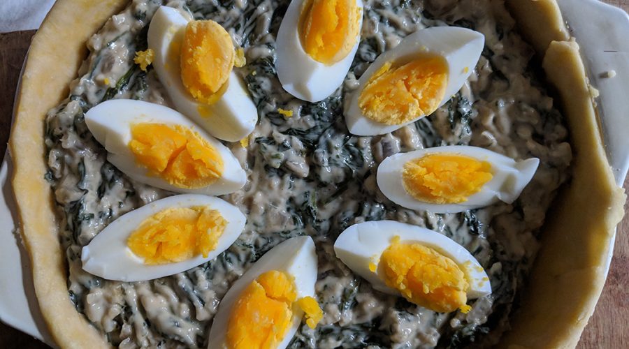 Pastel de Acelga with eggs - swiss chard bechamel filling with hard boiled eggs before top crust