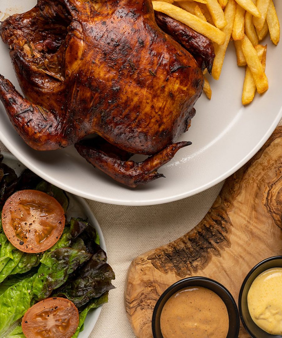 Peruvian pollo a la brasa with fries and salad