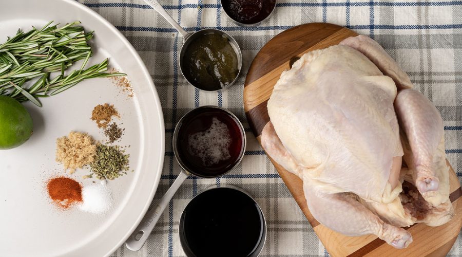 raw ingredients on a table for a Peruvian pollo a la brasa