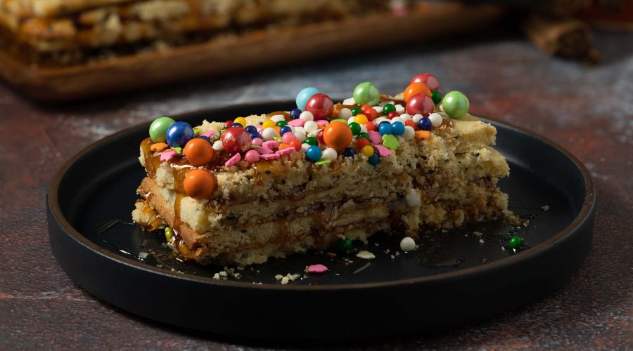 turron de dona pepa layers - peruvian anise shortbread dessert with spiced chancaca syrup cross section