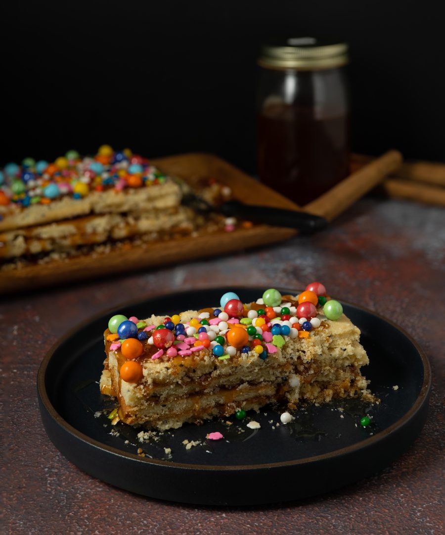 turron de dona pepa - authentic peruvian october dessert with colored sprinkles and candies on top