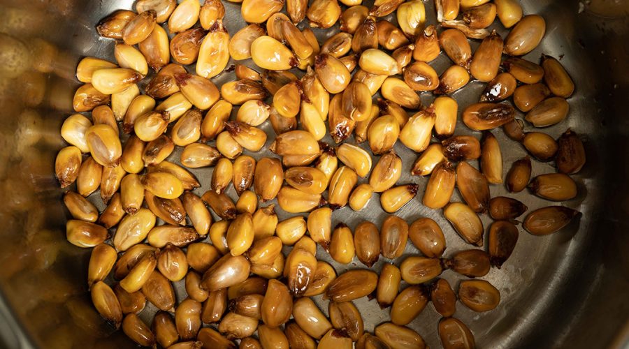 a pic of peruvian corn being cooked