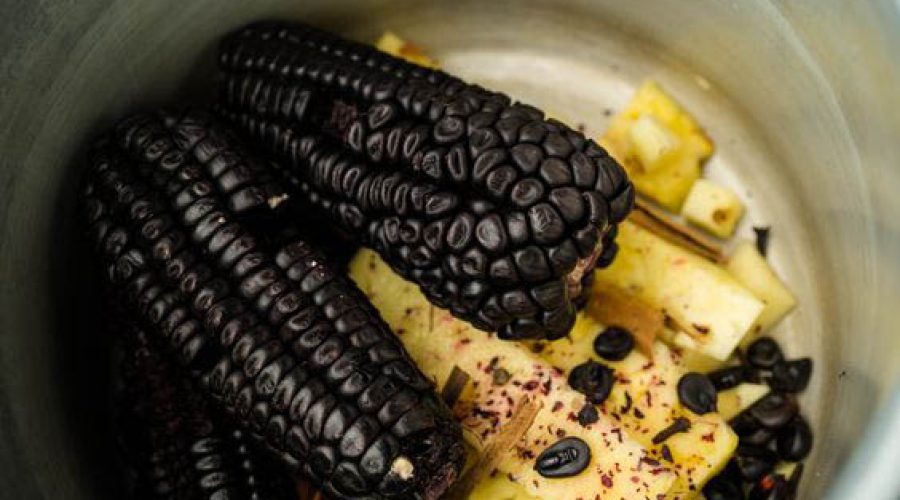 maiz morado peruano con piña y especias en una olla - Peruvian purple corn with pineapple and spices in a pot