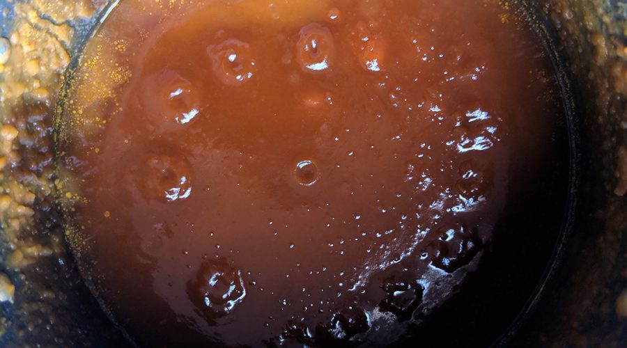 a pic of a pot in which sugars are being dissolved