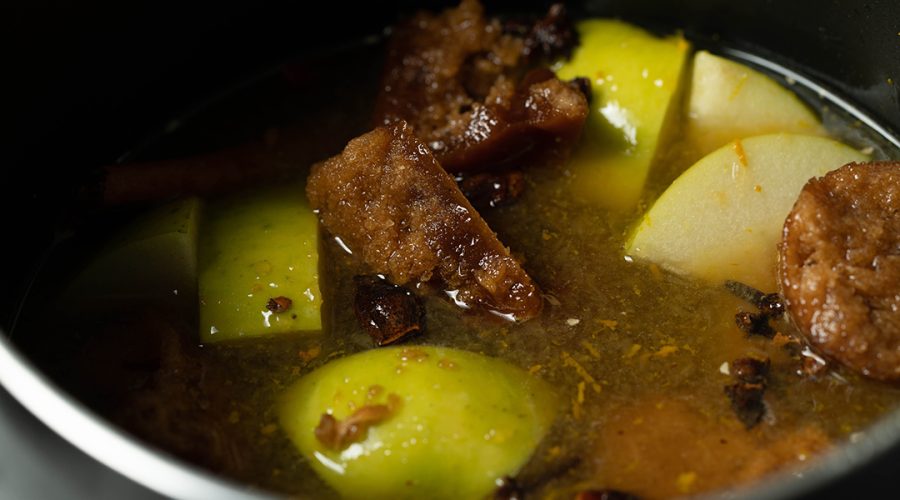 apples raw sugar and spices being boiled